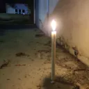 Lit candle at night