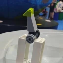 A lego construction with two wheels is balanced