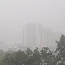Barely visible apartment in heavy rain